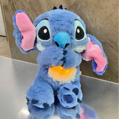 Blaues Plüsch-Stofftier mit großen Augen und pinken Ohren, leuchtender Bauch, Morivar Produkt